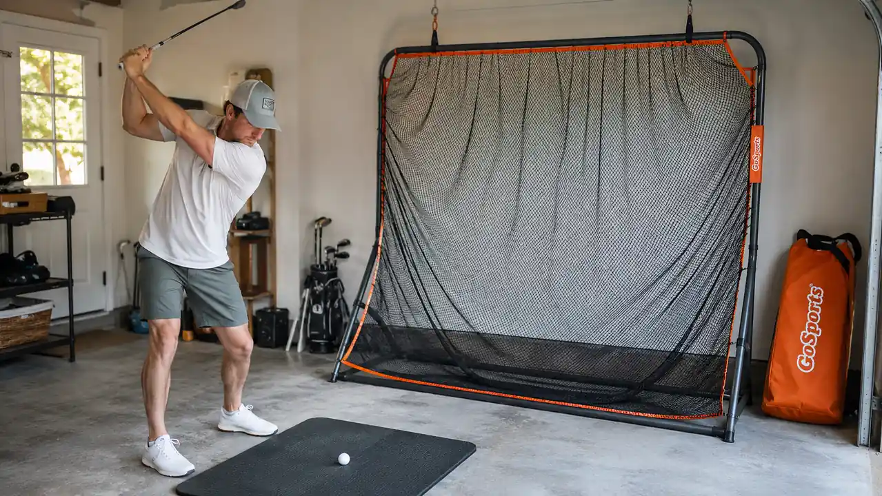 Close-up of the GoSports golf practice net frame and netting hanging inside a garage