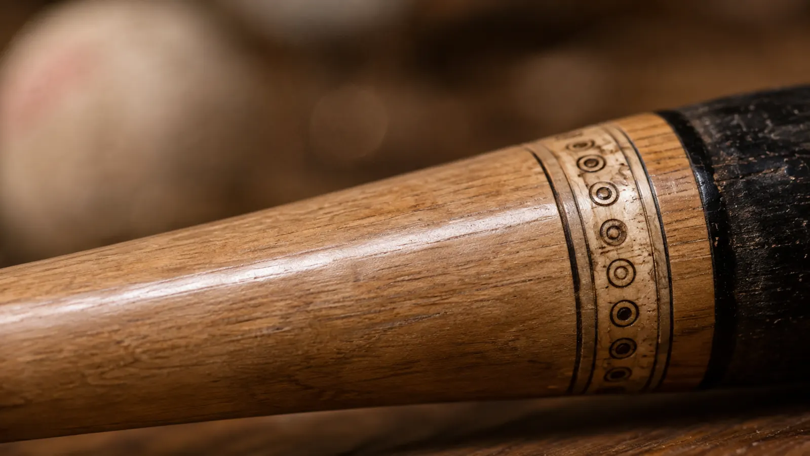 Close-up of the BBCOR certification stamp printed near the barrel taper of a composite baseball bat